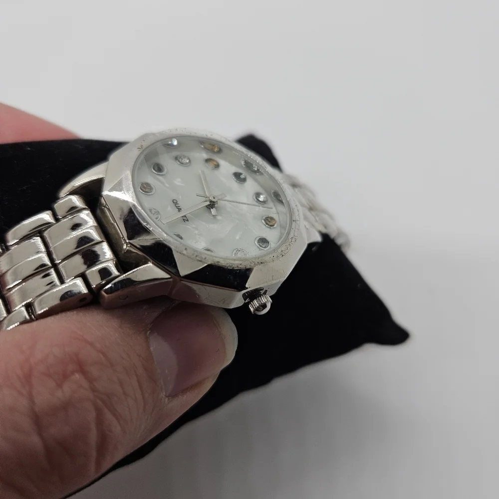 silver tone watch with rhinestone digits